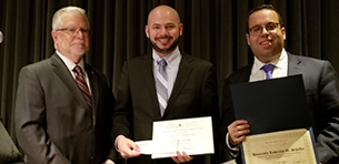 Left to right: Alan J. Schwartz, who presented the award, Brett Potash, Touro Law student and scholarship recipient; and Gene Rosen, President of the Jewish Lawyers Association of Nassau County.